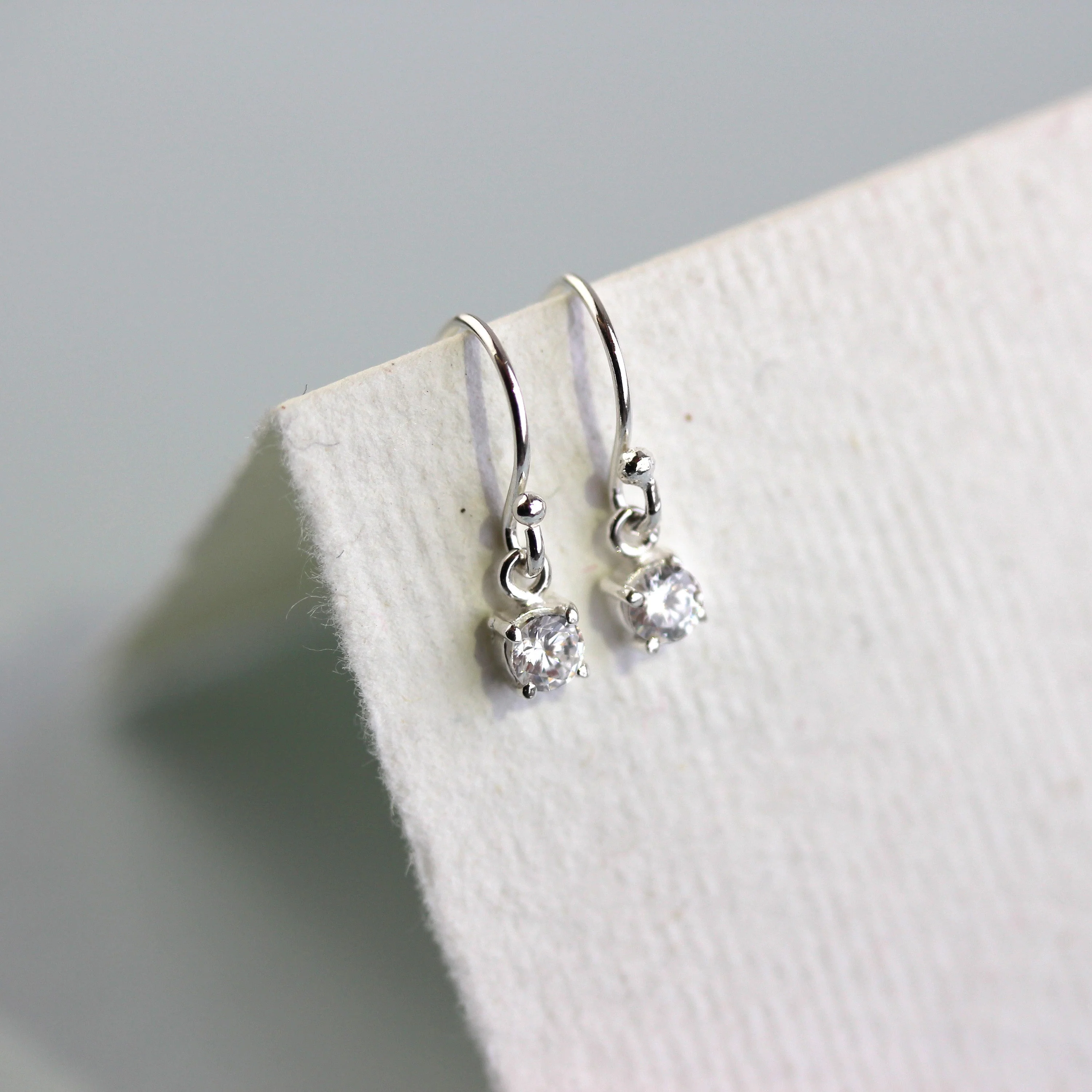 Sterling Silver Clear CZ April Birthstone Dangle Earrings - Image 3